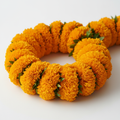 Hand-strung marigold lei with vibrant golden-orange blooms