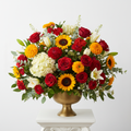 A grand extravagant fresh flower bouquet overflowing with vivid mixed seasonal blooms